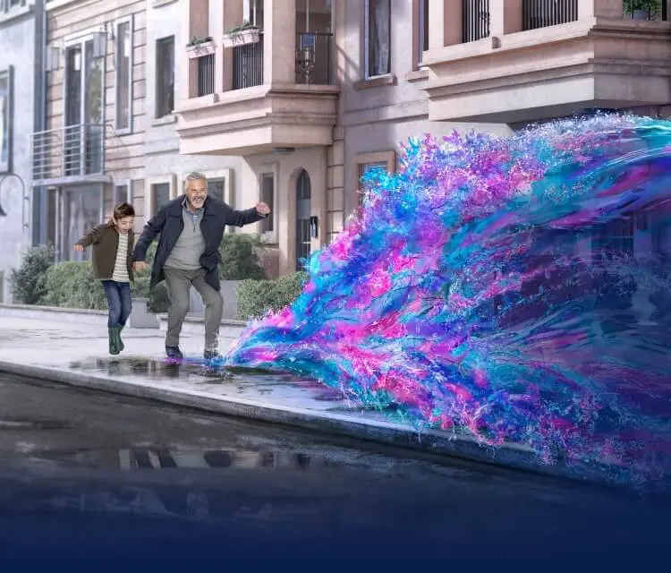 Man and boy jumping into water and making a splash